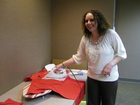 Club vice pres. Christine Winter shows how to iron out differences, er, club t-shirts. 